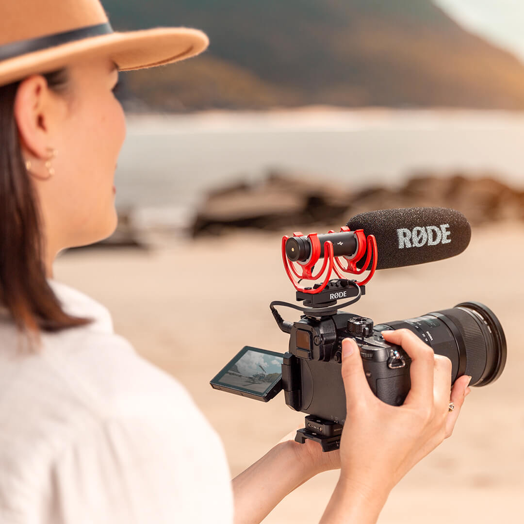 Girl with Rode VideoMic NTG Microphone on camera shooting outdoors