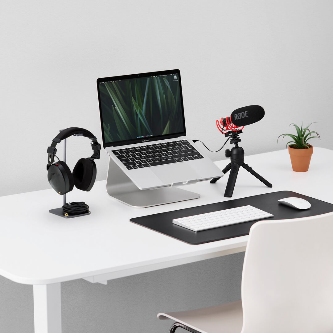 Rode VideoMic NTG Microphone on Tripod 2 connected to laptop with NTH-100 next to it