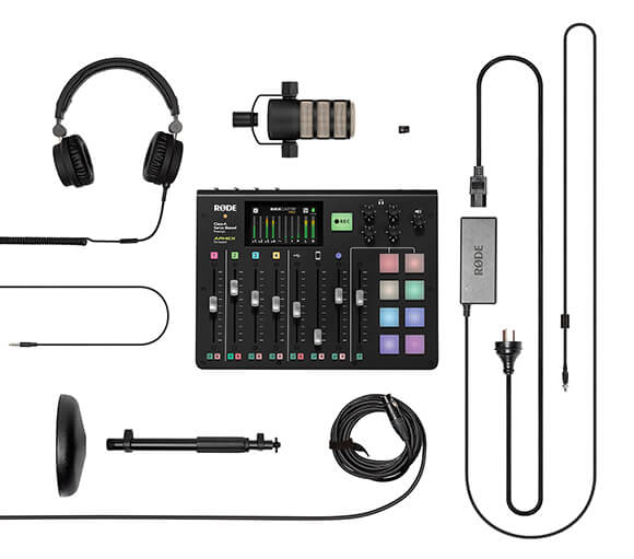 Flat lay containing RØDECaster Pro, power cable, XLR cable, DS1, headphones, PodMic and microSD card