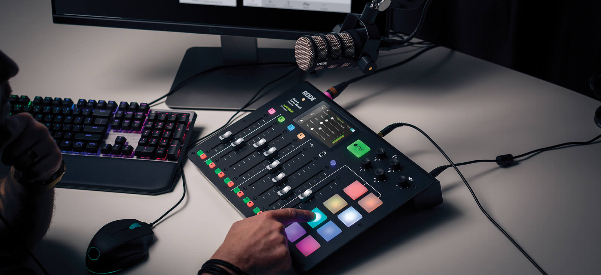 PodMic connected to RØDECaster Pro with finger pressing sound pad