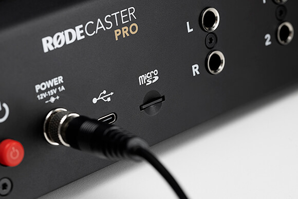 Back of RØDECaster Pro with close-up of microSD card slot, power cable, power button and USB connector