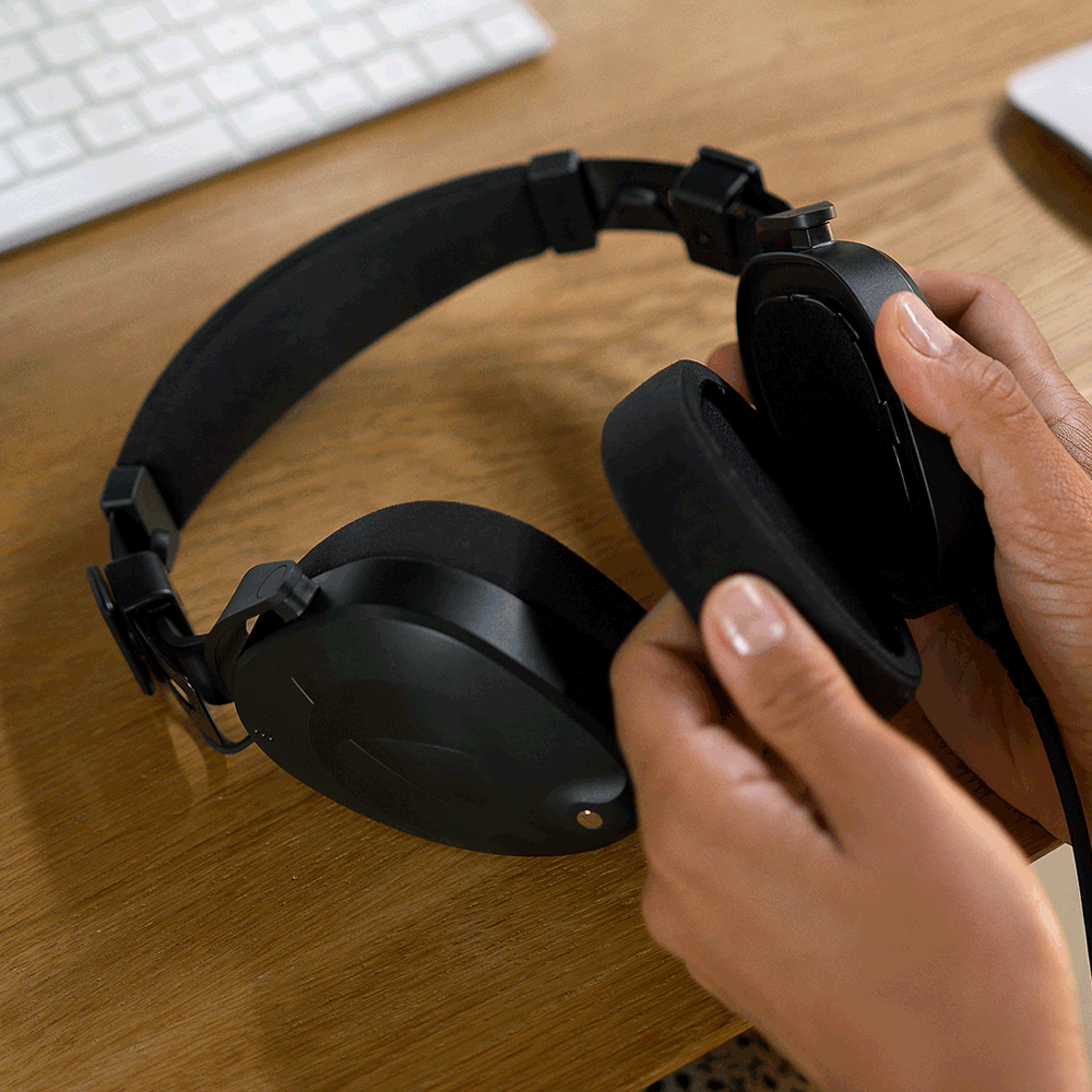 Hand removing earpads from NTH-100