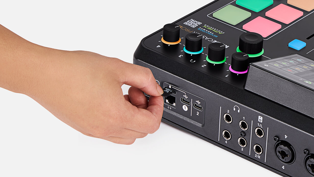Hand inserting microSD card in back of RØDECaster Pro II