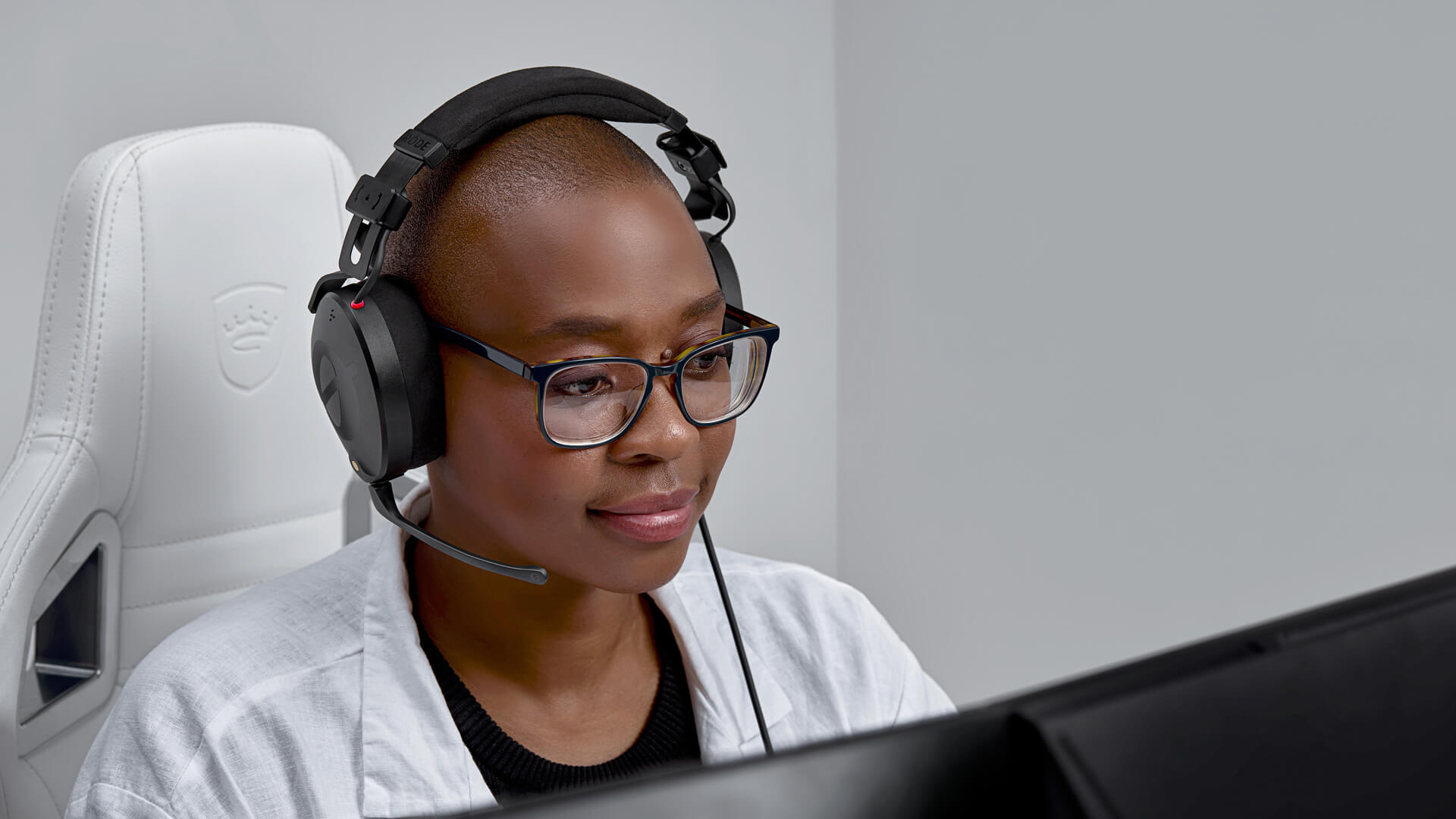 Girl in front of computer screen wearing NTH-100M