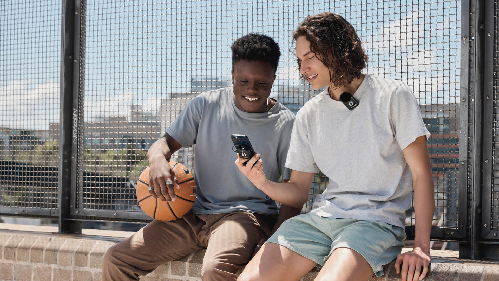 Basketball players reviewing recording made with Wireless ME