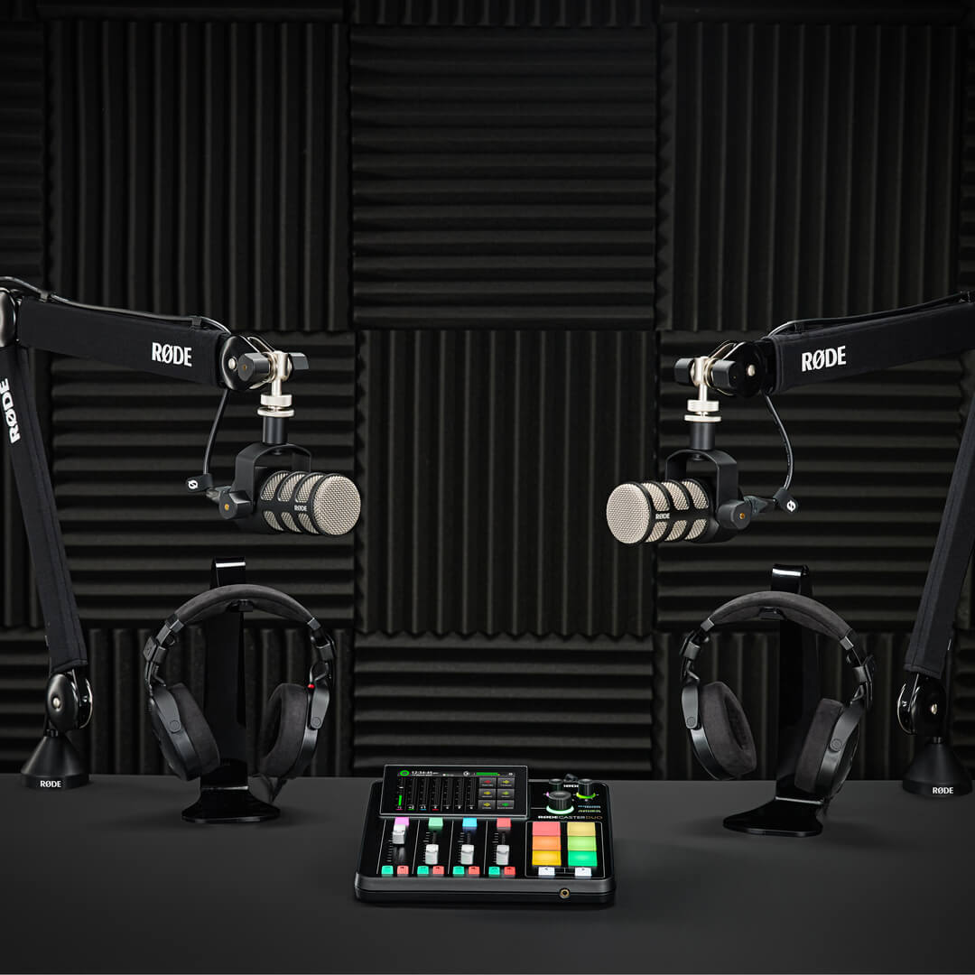 Two-person podcast setup with RØDECaster Duo, PodMics, PSA1+s and NTH-100s