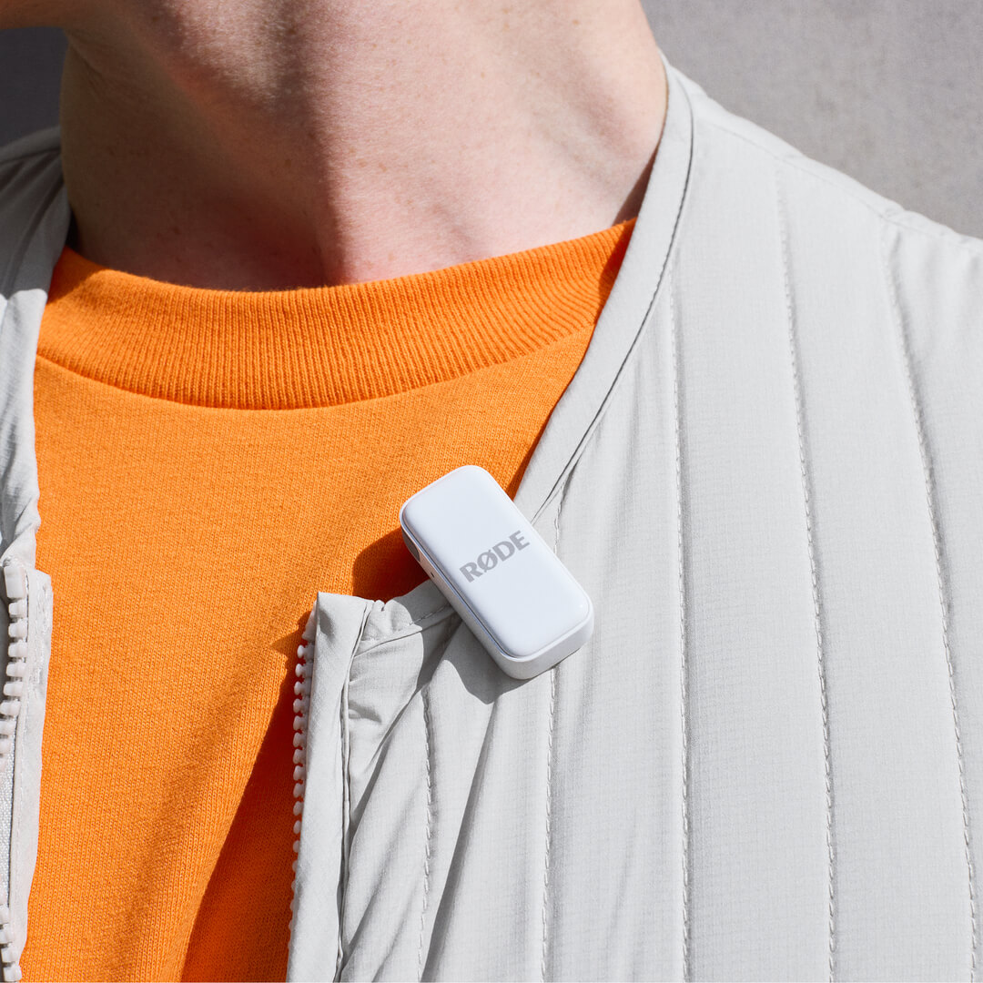 White Wireless Micro transmitter clipped to shirt