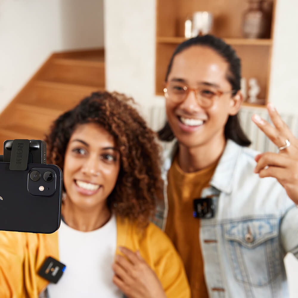 Couple vlogging on iPhone with Wireless GO II at home